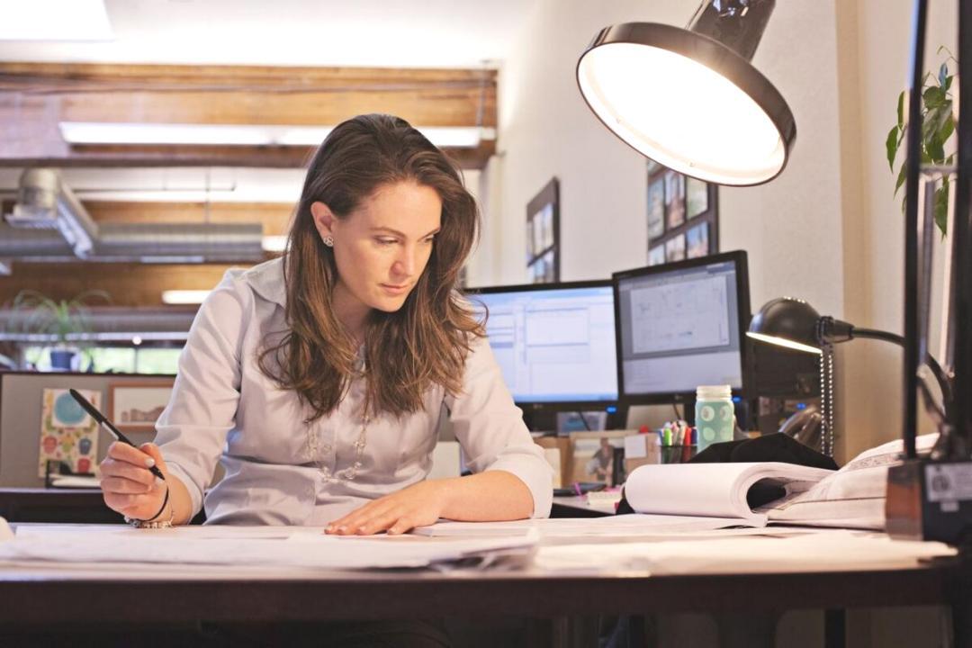 Trader reviewing international market data on screen